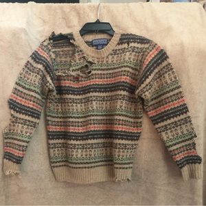 Newton Trading Co.destroyed Fair Isle Shetland wool sweater as seen on a model.